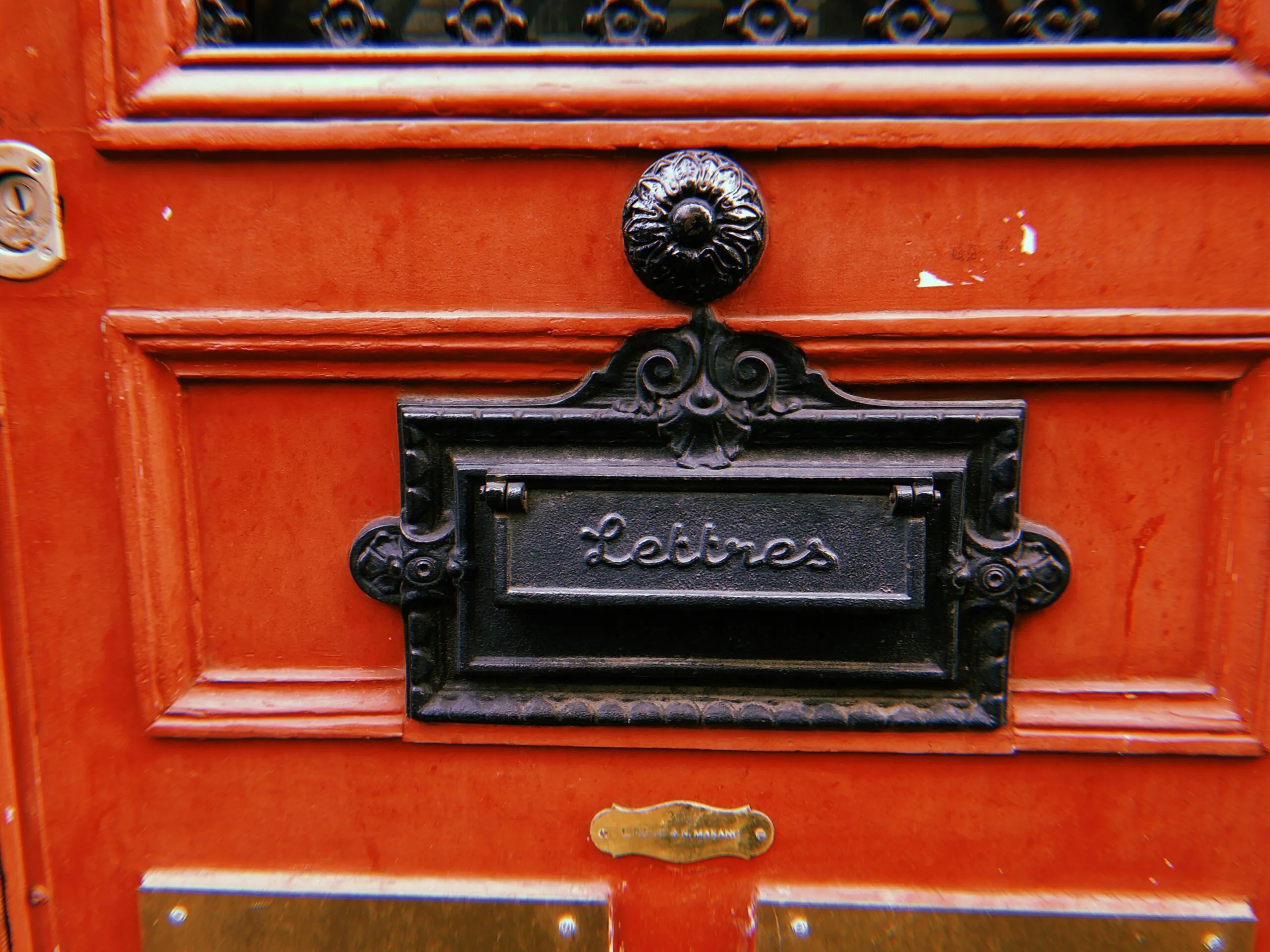mail slot in red door